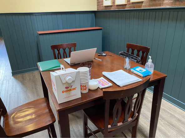 Survey setup with forms and coffee.